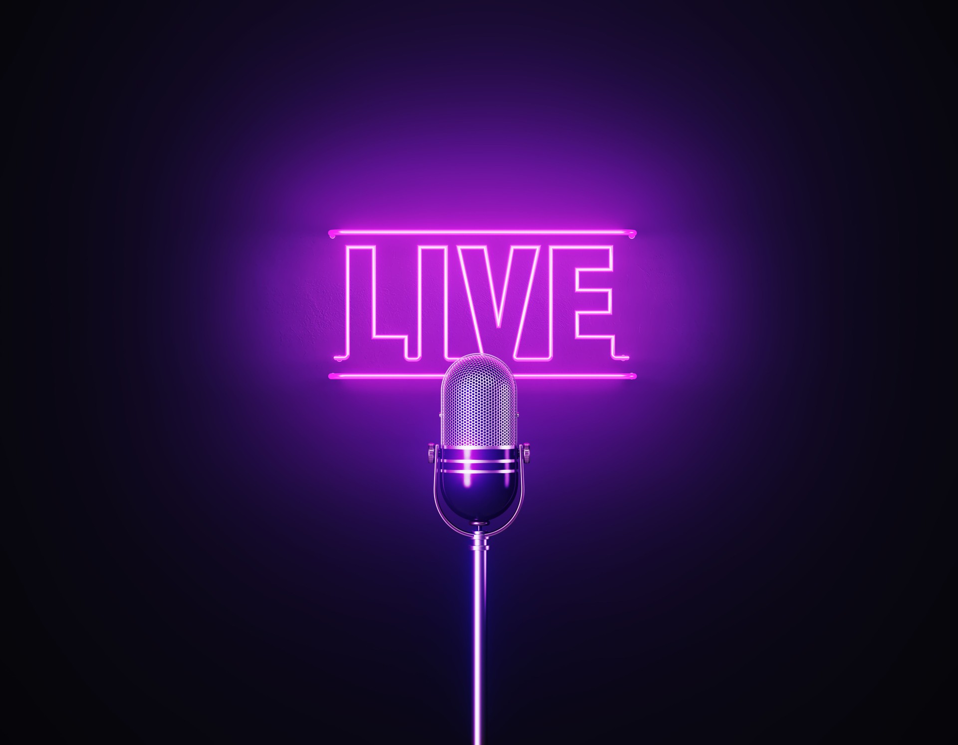 Purple Neon Light Writes Live Above A Silver Colored Microphone Over Black Background